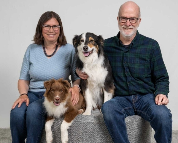 woman man and their 2 dogs.